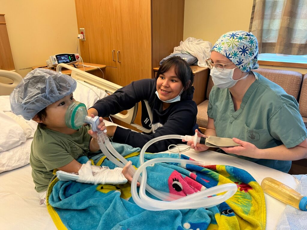 Tell-show-do-technique on the ward prior the surgery and on the operating table during a pediatric tour of the operating room.  