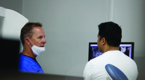 Patient consultation based on the CBCT image (Galileos, Dentsply Sirona). 